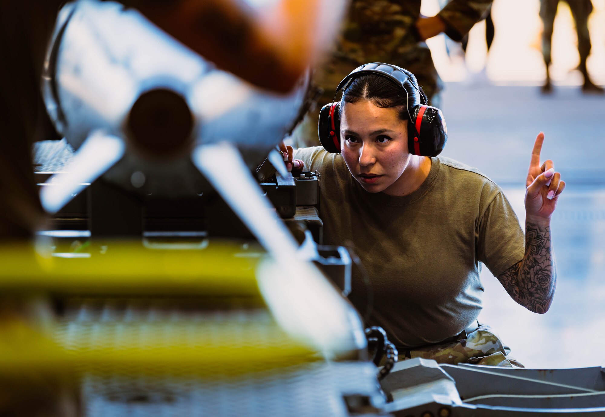 U.S. Air Force Staff Sgt. Kiyanna Nichter, 56th Maintenance Group weapons load crew member, secures an AIM-9X Sidewinder missile for a U.S. Air Force F-35A Lightning II during the third quarterly weapons load competition.