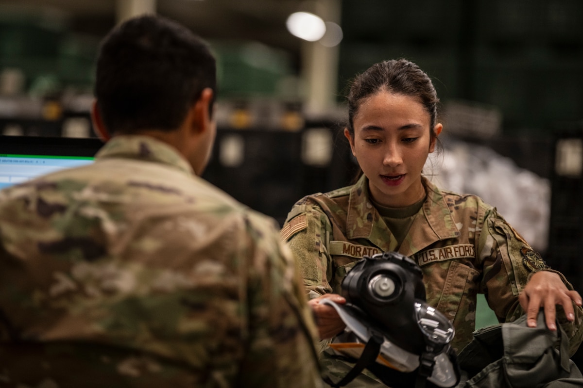 airman inspects masks