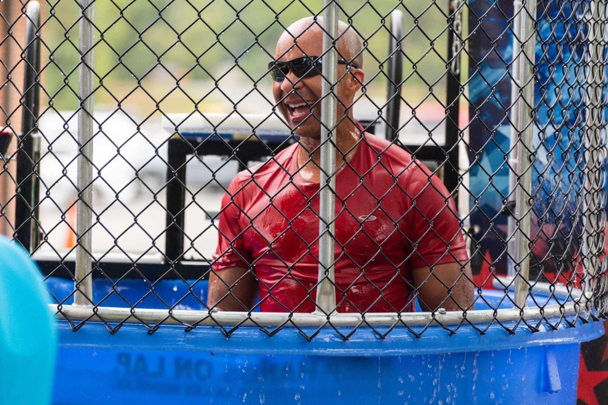 Arnold Engineering Development Complex Commander Col. Randel Gordon comes up for air after getting dunked in the dunk tank during the Arnold Air Force Base Sports Day event, Oct. 5, 2023, at the Arnold Lakeside Complex at Arnold AFB, Tenn. Along with dunk tank, events included running, pickleball, cornhole, volleyball, axe throwing, tug of war and disc golf. (U.S. Air Force photo by Keith Thornburgh)