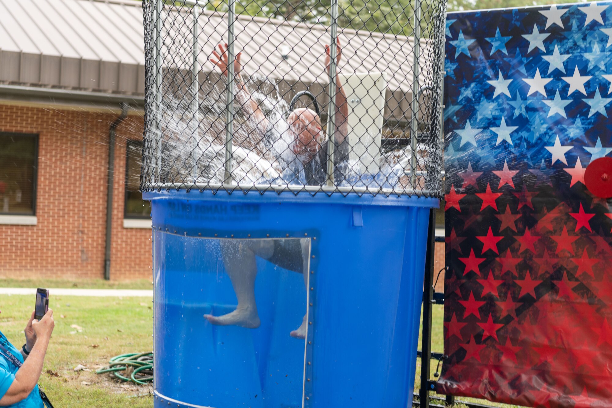 Col. Eric Withrow, Arnold Engineering Test Support Division chief, goes for a dip tank during the Arnold Air Force Base Sports Day event, Oct. 5, 2023, at the Arnold Lakeside Complex at Arnold AFB, Tenn. Along with dunk tank, events included running, pickleball, cornhole, volleyball, axe throwing, tug of war and disc golf. (U.S. Air Force photo by Keith Thornburgh)