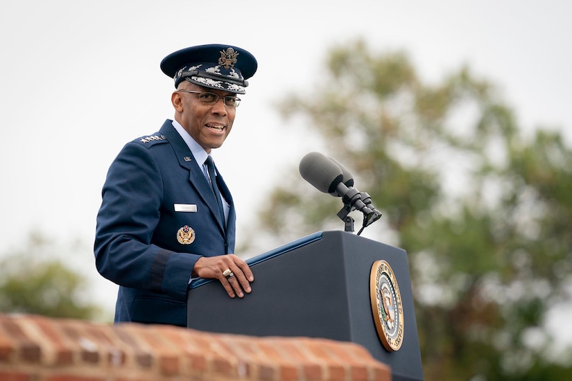 Air Force Gen. CQ Brown, Jr. speaks at a lectern outdoors.
