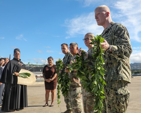 Joint Task Force-Red Hill (JTF-RH) leaders, hold a maile, a ceremonial Hawaiian lei, during a blessing ceremony for the Red Hill Bulk Fuel Storage Facility defueling process, Oct. 14, 2023, at Joint Base Pearl Harbor-Hickam, Hawaii.