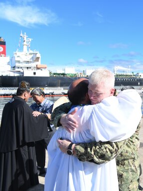 Joint Task Force-Red Hill (JTF-RH) Commander, U.S. Navy Vice Adm. John Wade embraces Kahu Kordell Kekoa Oct. 14, 2023, at Joint Base Pearl Harbor-Hickam, Hawaii,