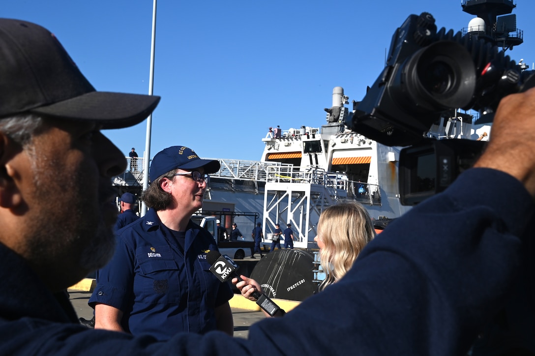 Capt. Rula Deisher, U.S. Coast Guard Cutter Munro's commanding officer, speaks with the media from the pier on Base Alameda, California, after Munro returned home from a 118-day Western Pacific deployment, Oct. 18. 2023. Munro's crew conducted a 23,000-mile, multi-month Western Pacific patrol operating in support of the U.S. Navy's Seventh Fleet by conducting multiple engagements with partner nations promoting a free and open Indo-Pacific. U.S. Coast Guard photo by Chief Petty Officer Matthew S. Masaschi.