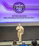 Capt. Mark Schuchmann, business and strategic planning officer, Code 1200, Business and Strategic Planning Office, speaks to Industry Day participants Oct. 5, 2023, at the Naval Undersea Museum in Keyport, Wash. (U.S.Navy photo by Max Maxfield)