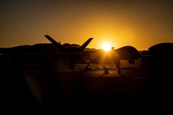 A U.S. Air Force MQ-9A Reaper assigned to the 432nd Air Expeditionary Wing, sits on the flightline during pre-flight operations at Camp Wilson, Marine Corps Air-Ground Combat Center, Twentynine Palms, California, July 27, 2023. The remotely piloted aircraft was used in Service Level Training Exercise (SLTE) 5-23, a joint exercise critical to increasing joint capabilities, proficiency and lethality. (U.S. Marine Corps photo by Lance Cpl. Jaelyn Twing)