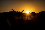 A U.S. Air Force MQ-9A Reaper assigned to the 432nd Air Expeditionary Wing, sits on the flightline during pre-flight operations at Camp Wilson, Marine Corps Air-Ground Combat Center, Twentynine Palms, California, July 27, 2023. The remotely piloted aircraft was used in Service Level Training Exercise (SLTE) 5-23, a joint exercise critical to increasing joint capabilities, proficiency and lethality. (U.S. Marine Corps photo by Lance Cpl. Jaelyn Twing)