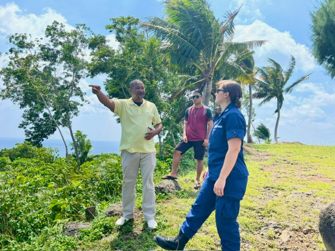 Governor Sharp Sakuma explains concerns with a channel entrance to Lt. Anna Vaccaro during a Ngaraard site visit in Palau on Oct. 13, 2023. Following the signing of an expanded bilateral law enforcement agreement in August, during the Joint Heads of Pacific Security conference, representatives of the U.S. Coast Guard and the Republic of Palau embarked on a series of meetings and initiatives to advance maritime partnership and promote regional stability. (U.S. Coast Guard photo)