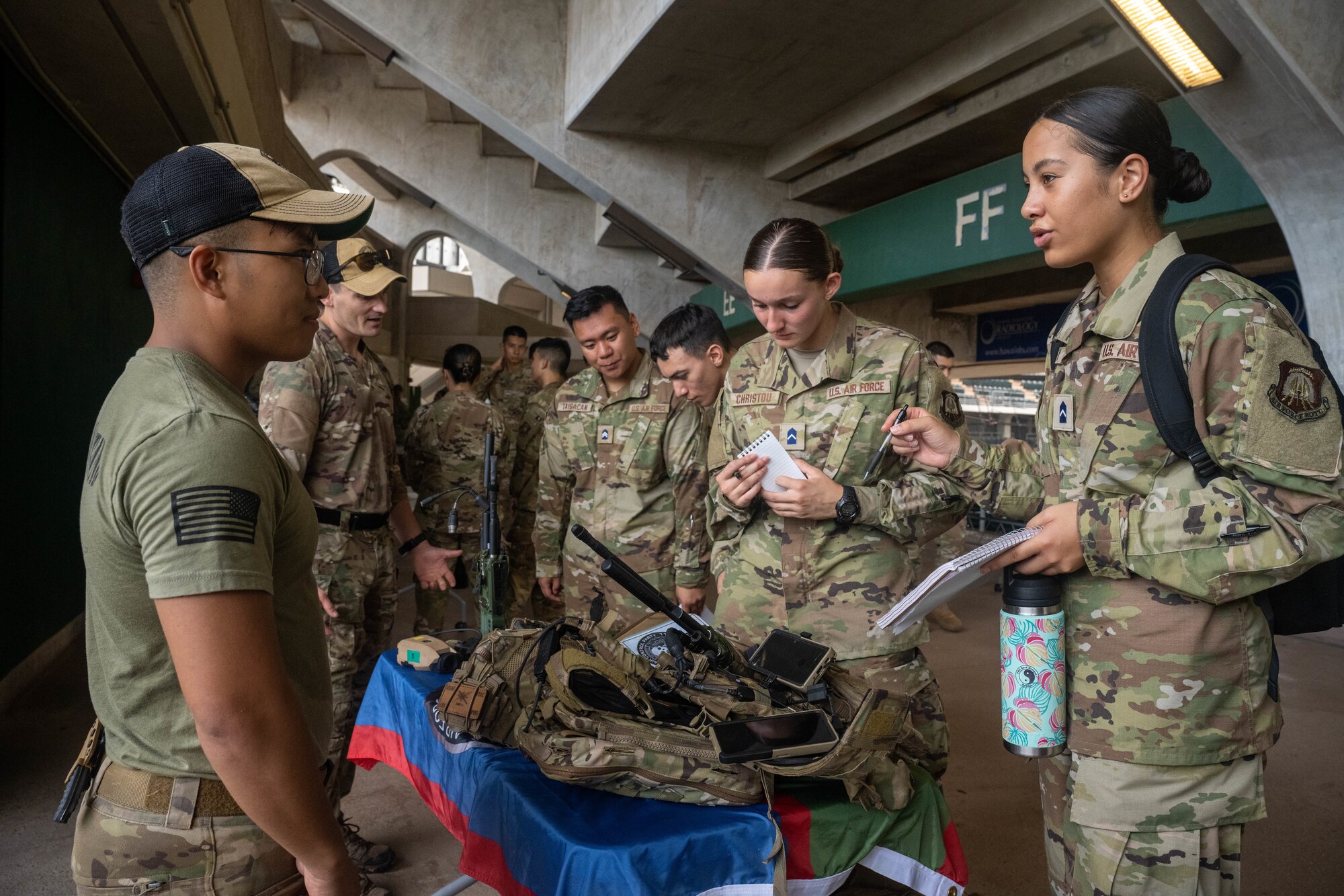 Officers assigned to the 25th Air Support Operations Squadron talk with Detachment 175, Air Force Reserve Officer Training Corps cadets, during a career day at the University of Hawaii at Manoa, Oct. 13, 2023. AFROTC cadets were given the opportunity to speak with officers from across Oahu and ask questions about their careers and the Air Force. (U.S. Air Force photo by Senior Airman Makensie Cooper)