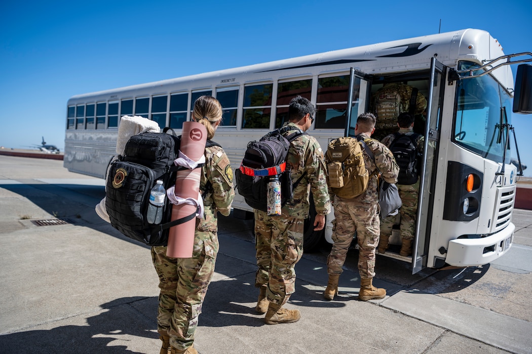 Airmen walk to the bus