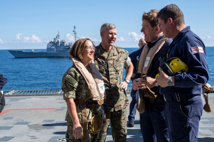 ATLANTIC OCEAN (Oct. 18, 2023) – Vice Chief of Naval Operations Adm. Lisa Franchetti, Commandant of the Marine Corps Gen. Eric Smith, and Royal Navy First Sea Lord and Chief of Naval Staff Adm. Sir Ben Key, tour the HMS Prince of Wales (R09), Oct. 18. While aboard, Franchetti, Smith and Key signed the Delivering Combined Seapower (DCS) charter, which is intended to achieve the Service Chiefs’ combined vision for US-UK interoperability moving toward interchangeability. (U.S. Navy photo by Chief Mass Communication Specialist Amanda R. Gray)