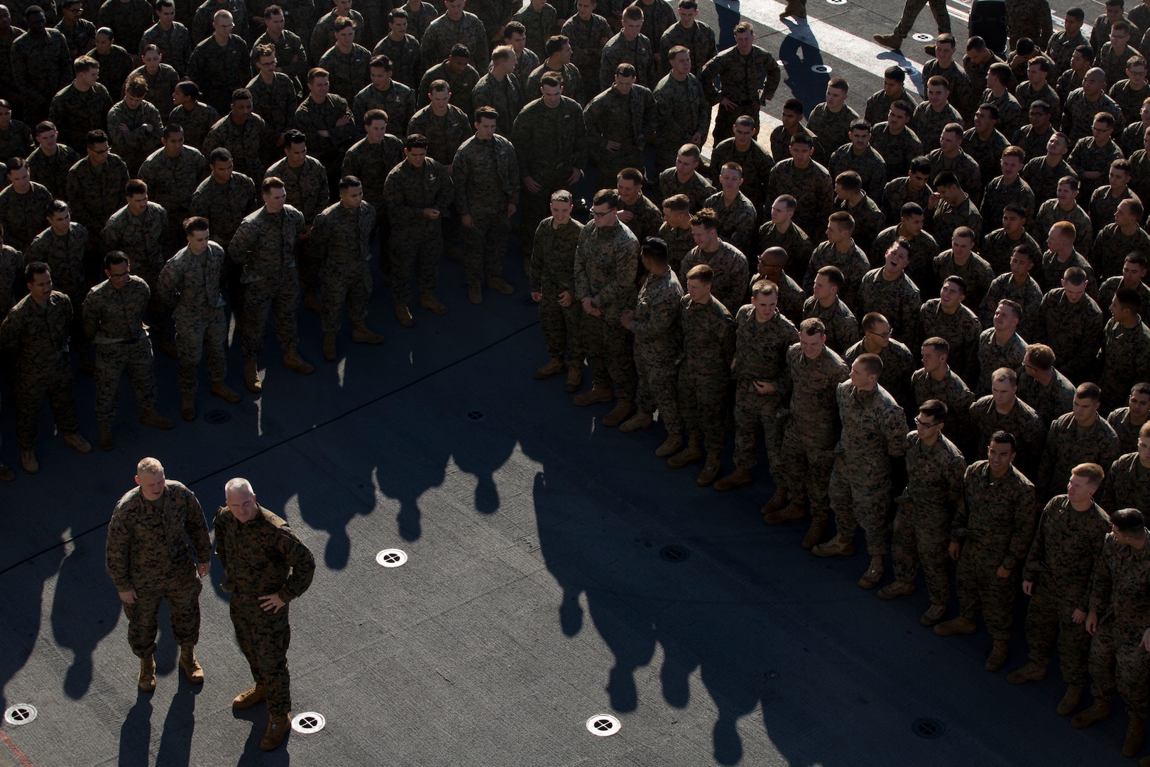 Marines stand in formation.