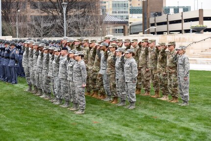 Troops stand in formation.