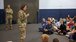 woman speaks to students