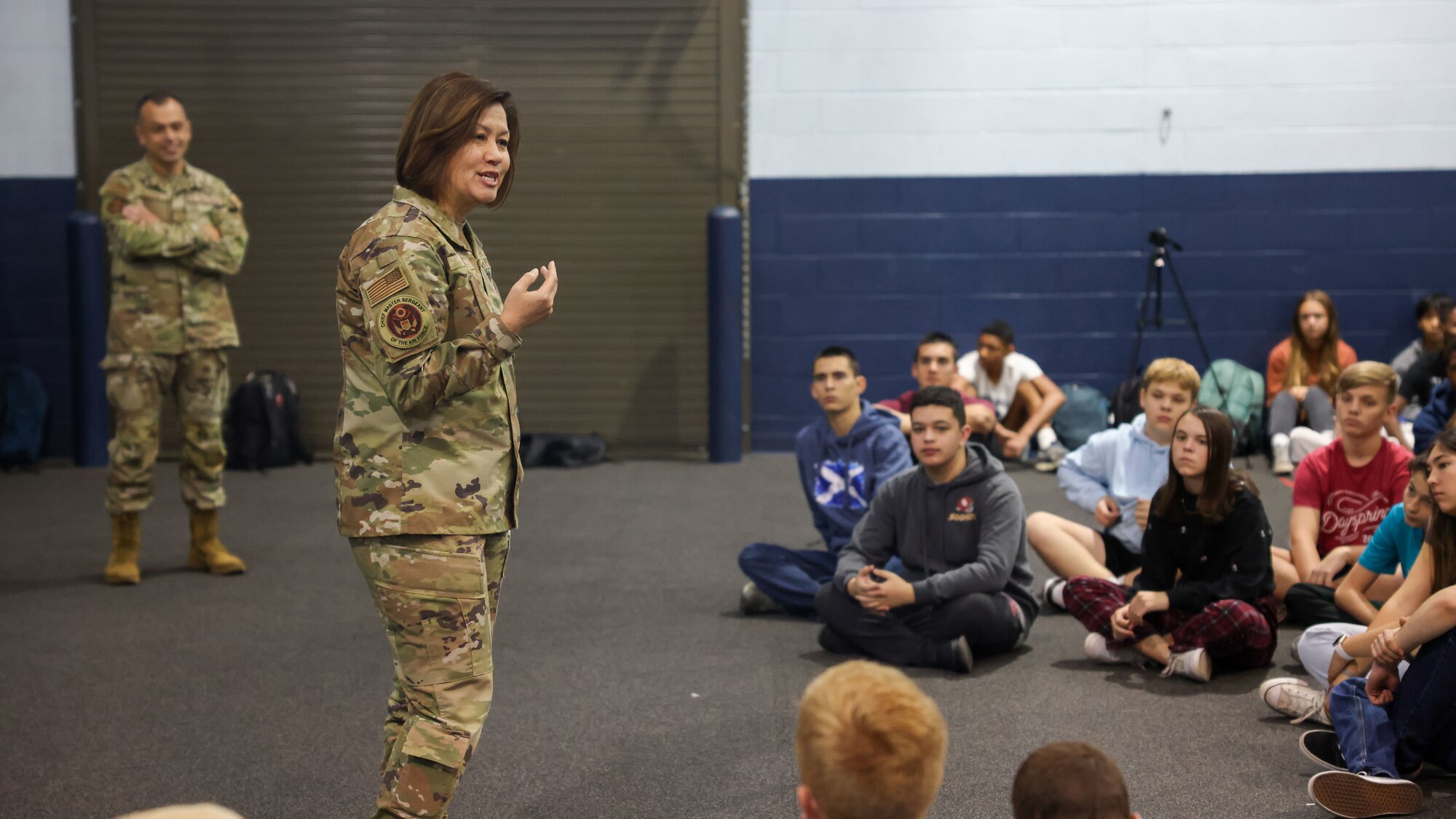 woman speaks to students