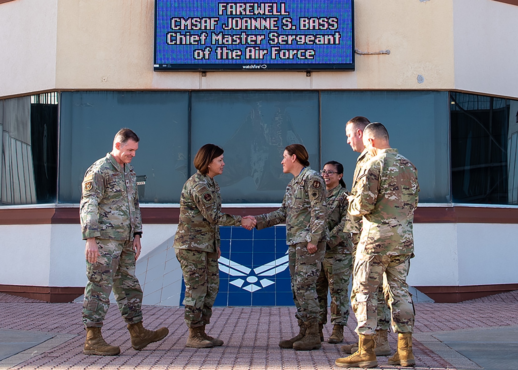 base leadership shakes hands