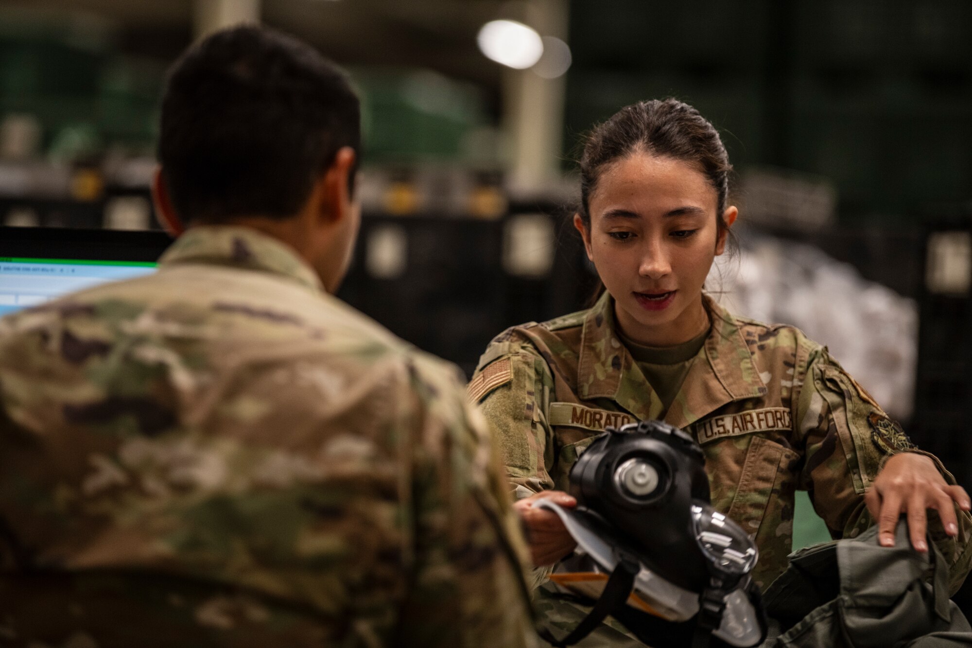 airman inspects masks