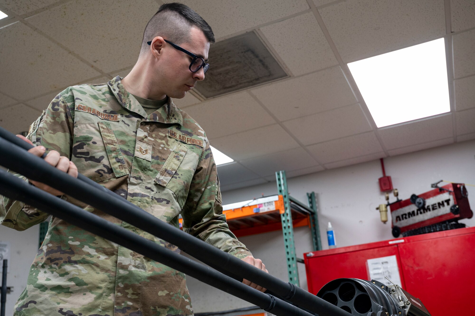 U.S. Air Force Staff Sgt. Joshua Olaguez, 49th Equipment Maintenance Squadron gun crew supervisor, lowers the weapon system of an F-16 Viper at Holloman Air Force Base, New Mexico, Oct. 10, 2023.