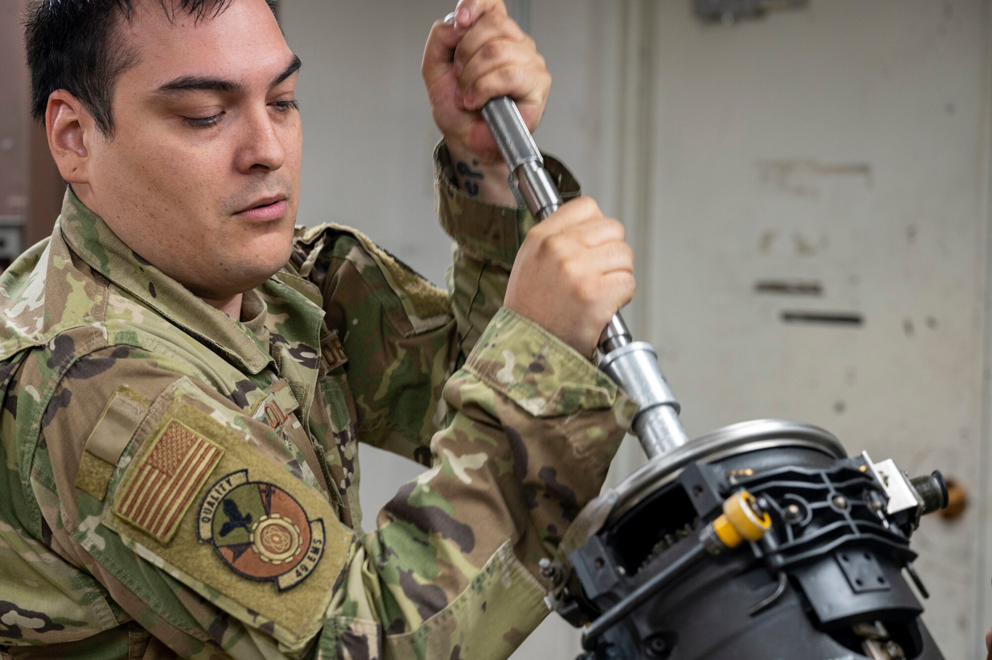 U.S. Air Force Staff Sgt. Joshua Olaguez, 49th Equipment Maintenance Squadron gun crew supervisor, lowers the weapon system of an F-16 Viper at Holloman Air Force Base, New Mexico, Oct. 10, 2023.