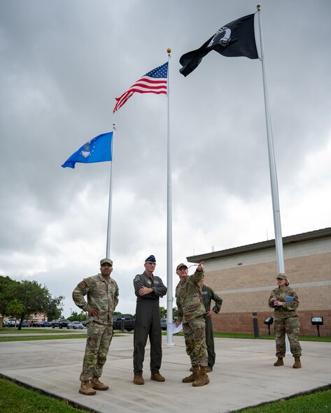 Col. Joshua Padgett, 482d Fighter Wing Commander, leads a base tour for Lt. Gen. John P. Healy, Chief of Air Force Reserve, and Chief Master Sergeant Israel Nuñez, Senior Enlisted Advisor to the Chief of Air Force Reserve, at the HQ building of Homestead Air Reserve Base, Florida, on Oct. 14, 2023.
