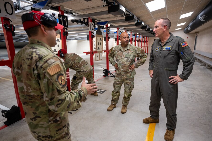 Inside the Small Arms Training Facility, Master Sgt. Matthew Dickson, 482d Security Forces Squadron, details its capabilities to Lt. Gen. John P. Healy, Chief of Air Force Reserve, and Chief Master Sergeant Israel Nuñez, Senior Enlisted Advisor to the Chief of Air Force Reserve, at Homestead Air Reserve Base, Florida, on Oct. 14, 2023.