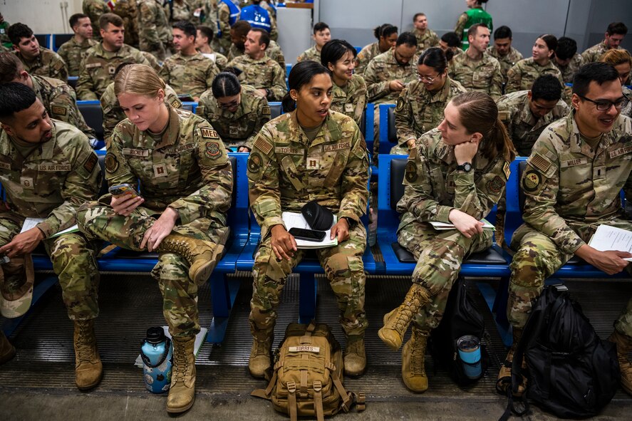 U.S. Airmen receive a pre-deployment briefing at Travis Air Force Base, California, Sept. 26, 2023. Over 400 Airmen were the first on Travis AFB to experience the Air Force’s new deployment model, Air Force, Force Generation. (U.S. Air Force photo by Nicholas Pilch)