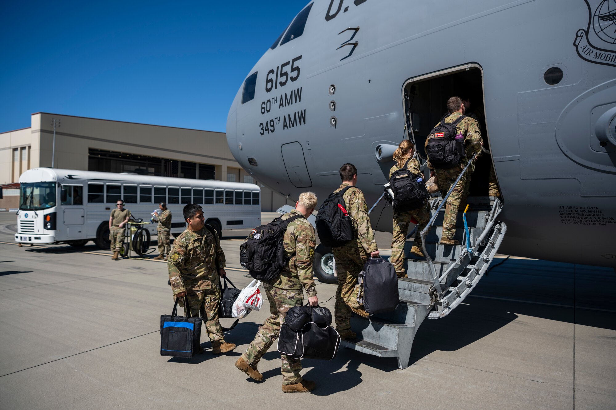 Airmen walking up to an airplane