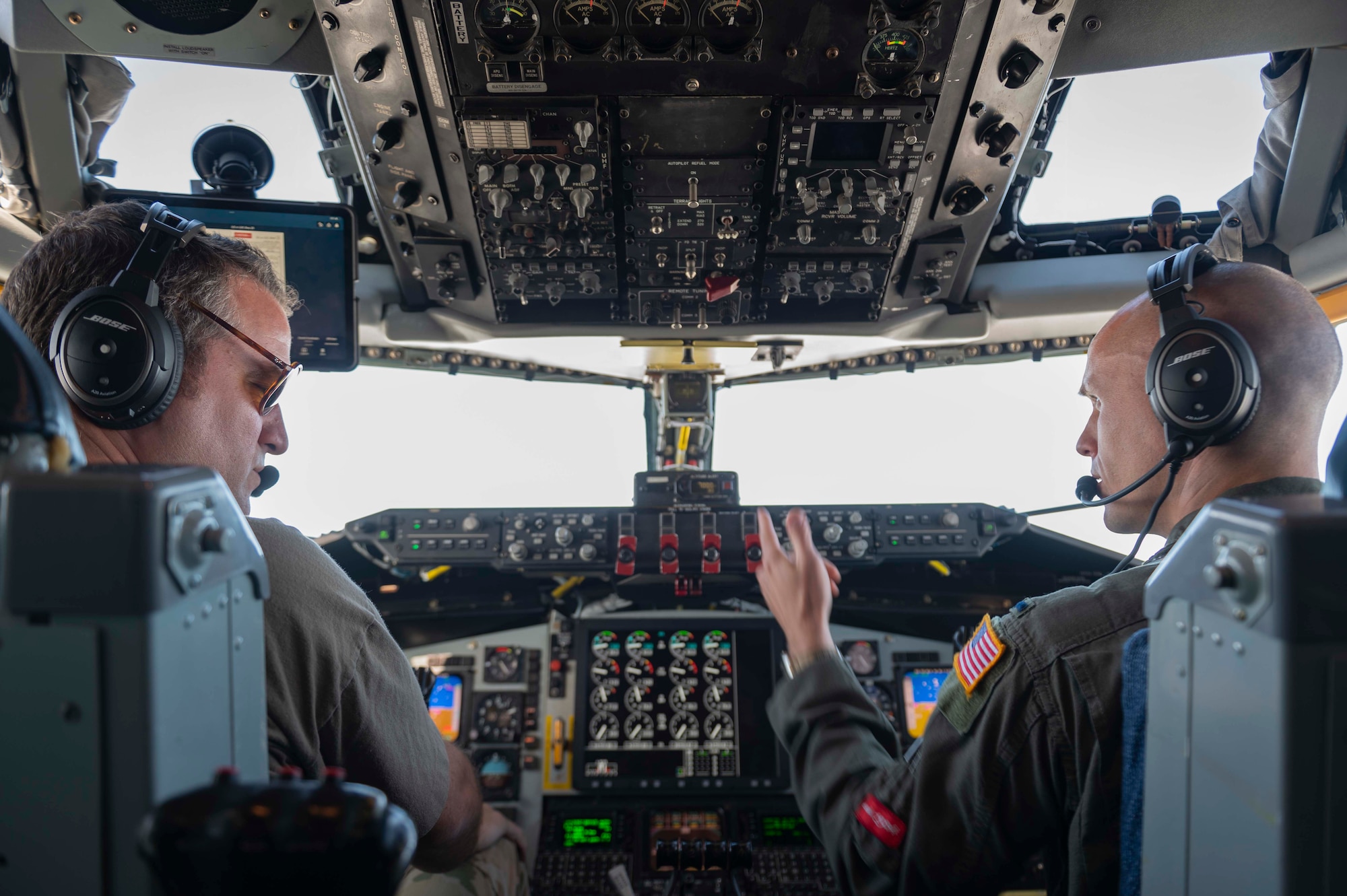 Two pilots talk in aircraft