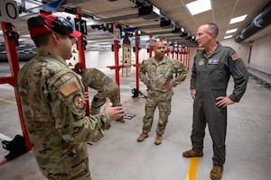 Inside the Small Arms Training Facility, Master Sgt. Matthew Dickson, 482d Security Forces Squadron, details its capabilities to Lt. Gen. John P. Healy, Chief of Air Force Reserve, and Chief Master Sergeant Israel Nuñez, Senior Enlisted Advisor to the Chief of Air Force Reserve, at Homestead Air Reserve Base, Florida, on Oct. 14, 2023.