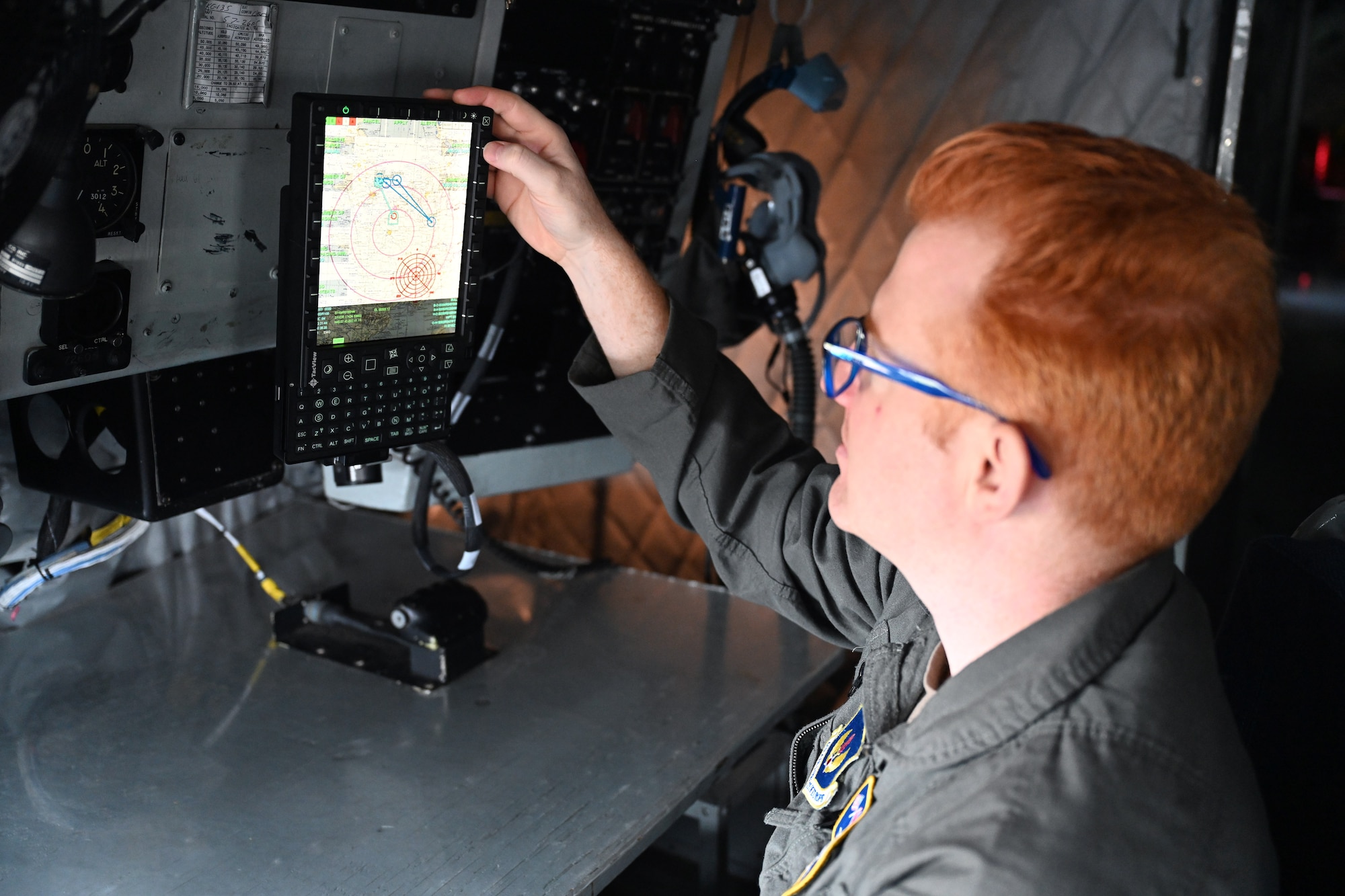 U.S. Air Force Tech. Sgt. Eric Severs, 100th Operations Support Squadron boom operator and NCO in charge of wing tactics, reviews a geographic reference point – otherwise known as a “bullseye” – on a Real-Time Information in the Cockpit system (more commonly known as “RTIC”) to tactically identify locations within the European theater on a KC-135 Stratotanker at Royal Air Force Mildenhall, England, Oct. 18, 2023.  The newly installed communications system gives aircrew the ability to access vital information including threats, target data and locations of friendly forces, providing even more accurate and instant information. (U.S. Air Force photo by Karen Abeyasekere)