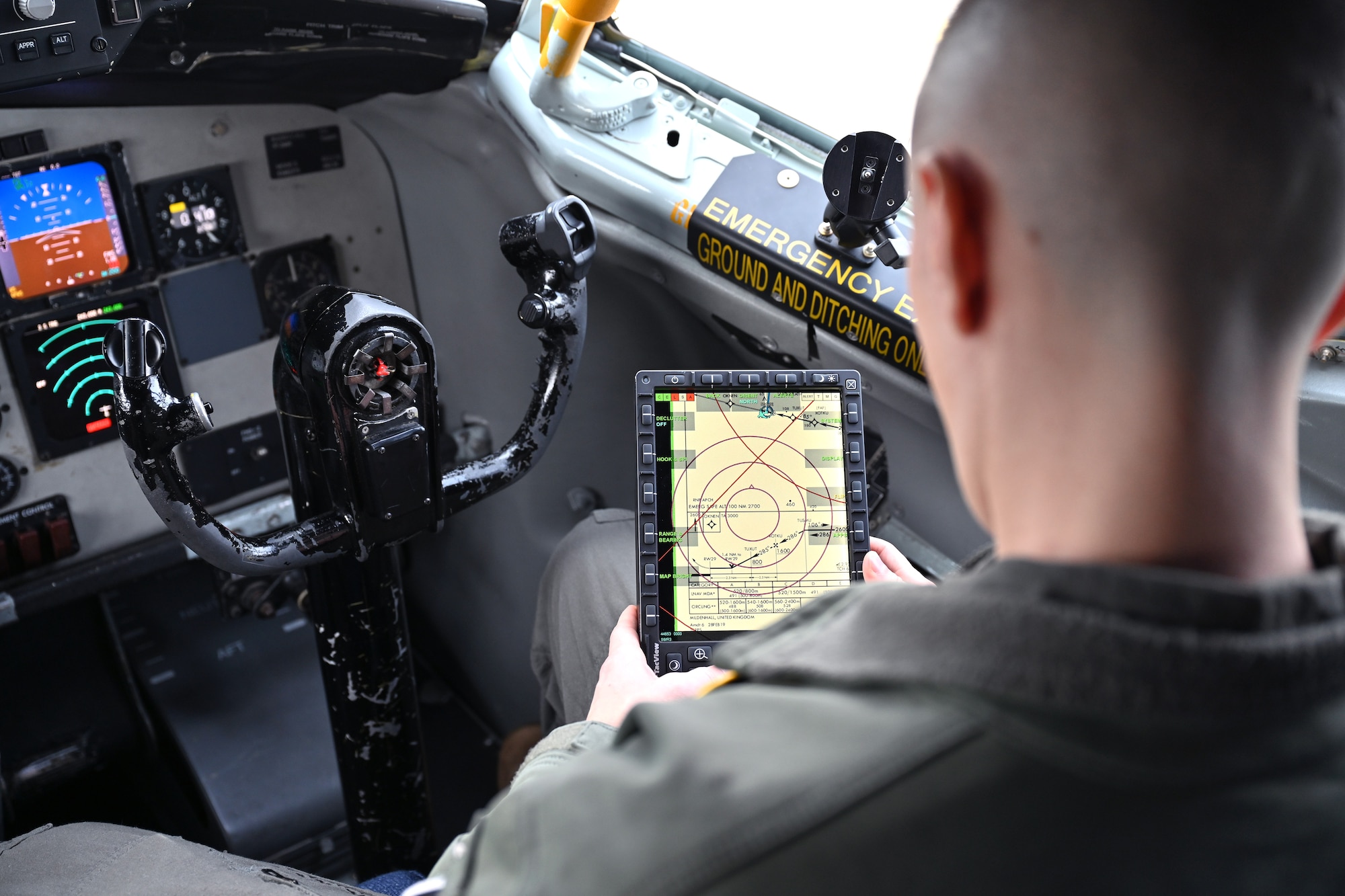 U.S. Air Force Capt. Anthony Vecchio, 100th Operations Support Squadron pilot and wing tactics officer, reviews a map on the Real-Time Information in the Cockpit system on board a KC-135 Stratotanker at Royal Air Force Mildenhall, England, Oct. 18, 2023. The newly installed communications system gives aircrew the ability to access vital information including threats, target data and locations of friendly forces, providing much even accurate and instant information. (U.S. Air Force photo by Karen Abeyasekere)