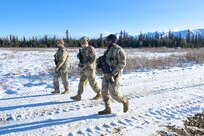 Alaska Airmen from the 168th Security Forces Squadron survey the forward operating base at Fort Greely Donnelly Training Area during Agile Combat Employment training Oct. 12-16, 2023. The 168th Defenders taught 168th Civil Engineer Airmen entry control procedures in dynamic remote environments and trained with the 168th Civil Engineer Squadron on heavy equipment.