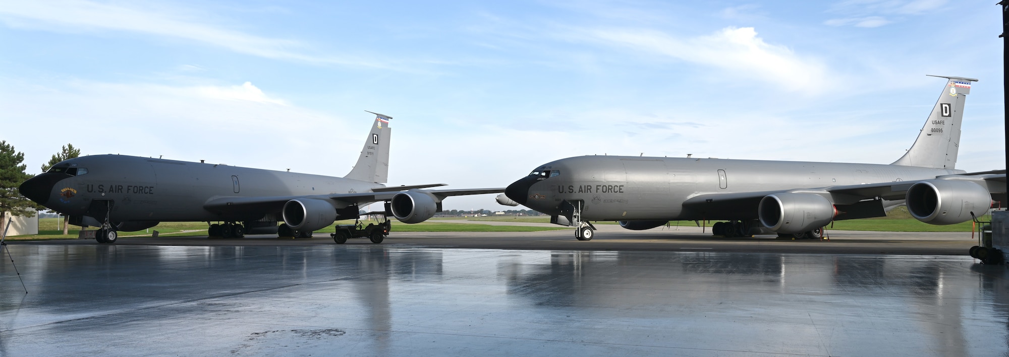 Two U.S. Air Force KC-135 Stratotankers show off their new heritage nose art – “Squawkin Hawk”, left, and “Silver Dollar” – after a nose art dedication ceremony at Royal Air Force Mildenhall, England, Oct. 10, 2023. Each of the 100th ARW’s tankers bears a heritage nose art, based on those painted on the side of B-17 Flying Fortress aircraft at the 100th Bomb Group during World War II, and Silver Dollar is the only double-sided design in the fleet. (U.S. Air Force photo by Karen Abeyasekere)