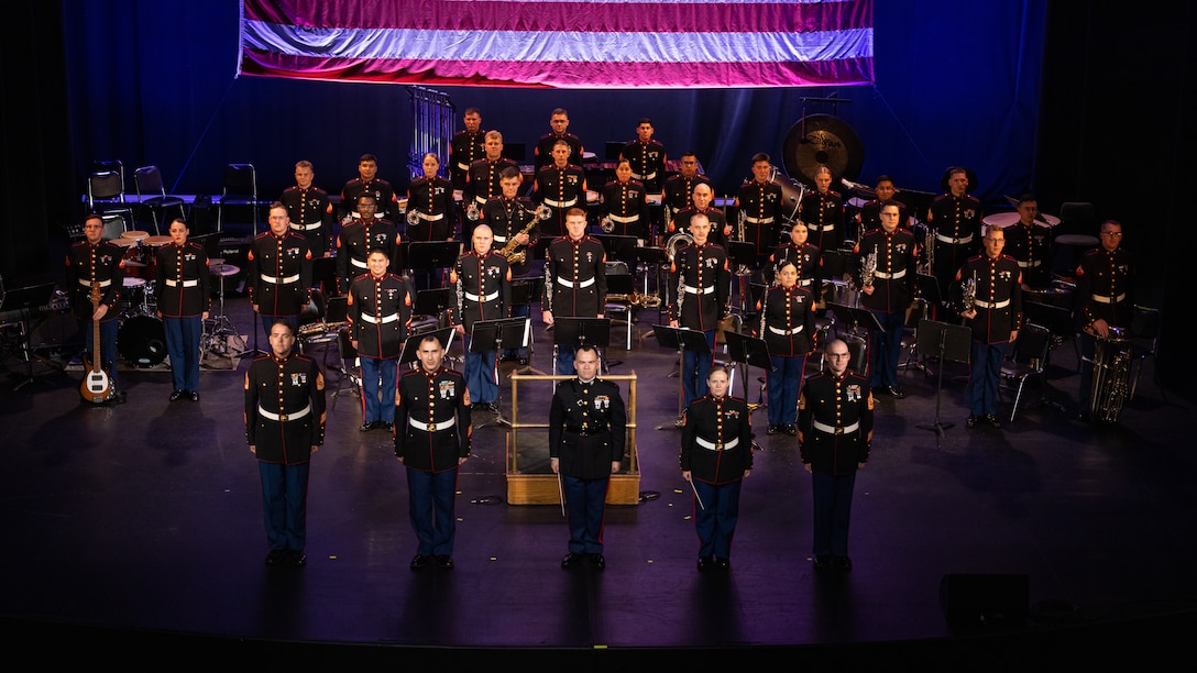 U.S. Marines with the 2nd Marine Aircraft Wing (MAW) Band pose for a group photo during the 34th Annual Vincent Vizzo Columbus Day Concert at Bridgeport, Connecticut, Oct. 6, 2023. Marines with the 2nd MAW Band performed during the 34th Annual Vincent Vizzo Columbus Day Concert to strengthen community relationships and reaffirm history, customs, and traditions representative of the United States Marine Corps to those in attendance. 2nd MAW is the aviation combat element of II Marine Expeditionary Force. (U.S. Marine Corps photo by Lance Cpl. Orlanys Diaz Figueroa)