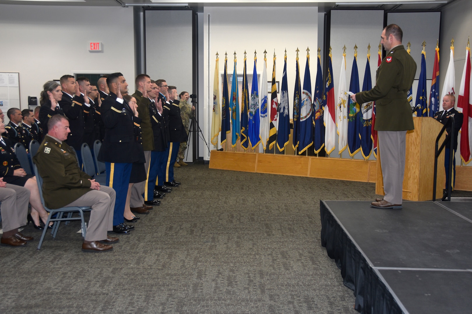 Brig. Gen. Matthew Strub, Wisconsin’s deputy adjutant general for Army, administers the oath of office to seven officers and 11 warrant officers, completing their journey to becoming officers and warrant officers in the Wisconsin Army National Guard, during a commissioning ceremony Oct. 14 at the Wisconsin Military Academy, Fort McCoy, Wis.