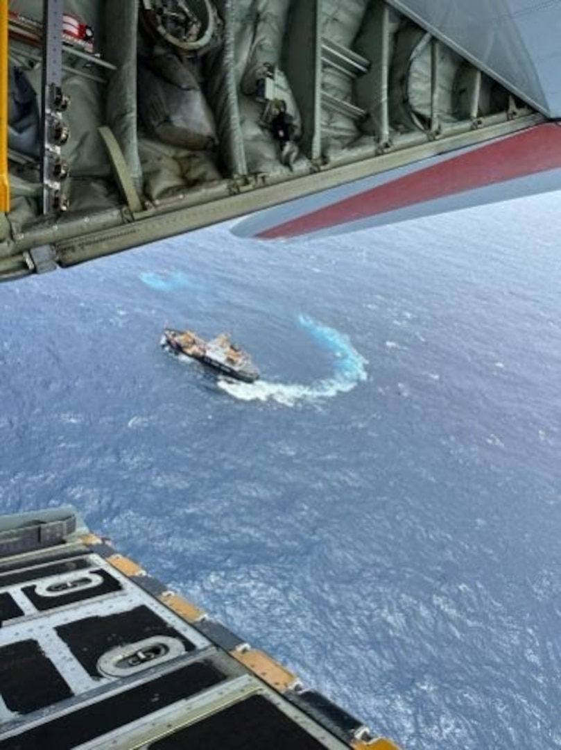 A U.S. Coast Guard Air Station Barbers Point, Hawaii, HC-130 Hercules aircraft 2007, flies over the U.S. Coast Guard Cutter Alder during Operation Southern Shield 2023, October 2023.