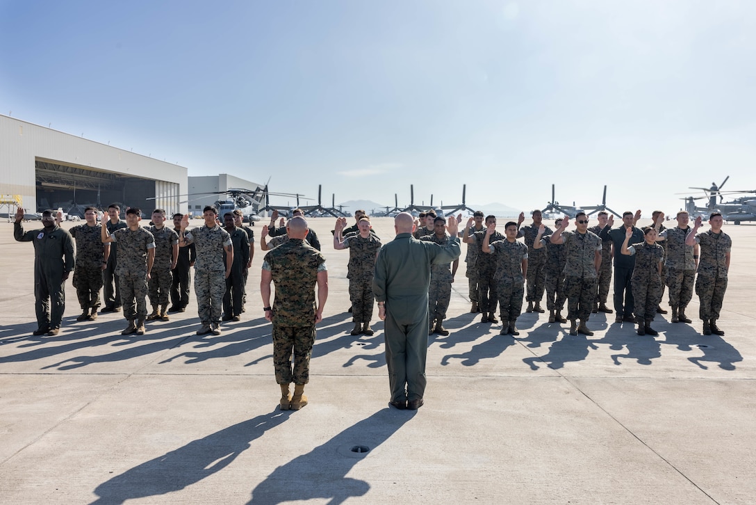 U.S. Marines with Marine Aircraft Group 16, 3rd Marine Aircraft Wing, conduct the oath of enlistment at Marine Corps Air Station Miramar, California, Oct. 18, 2023.  MAG-16 is exceeding the fiscal year 2024 retention mission by reenlisting 62 Marines. The retention of the best and most qualified Marines is vital for shaping and sustaining the Marine Corps as an elite fighting force. (U.S. Marine Corps photo by Lance Cpl. Jennifer Sanchez)