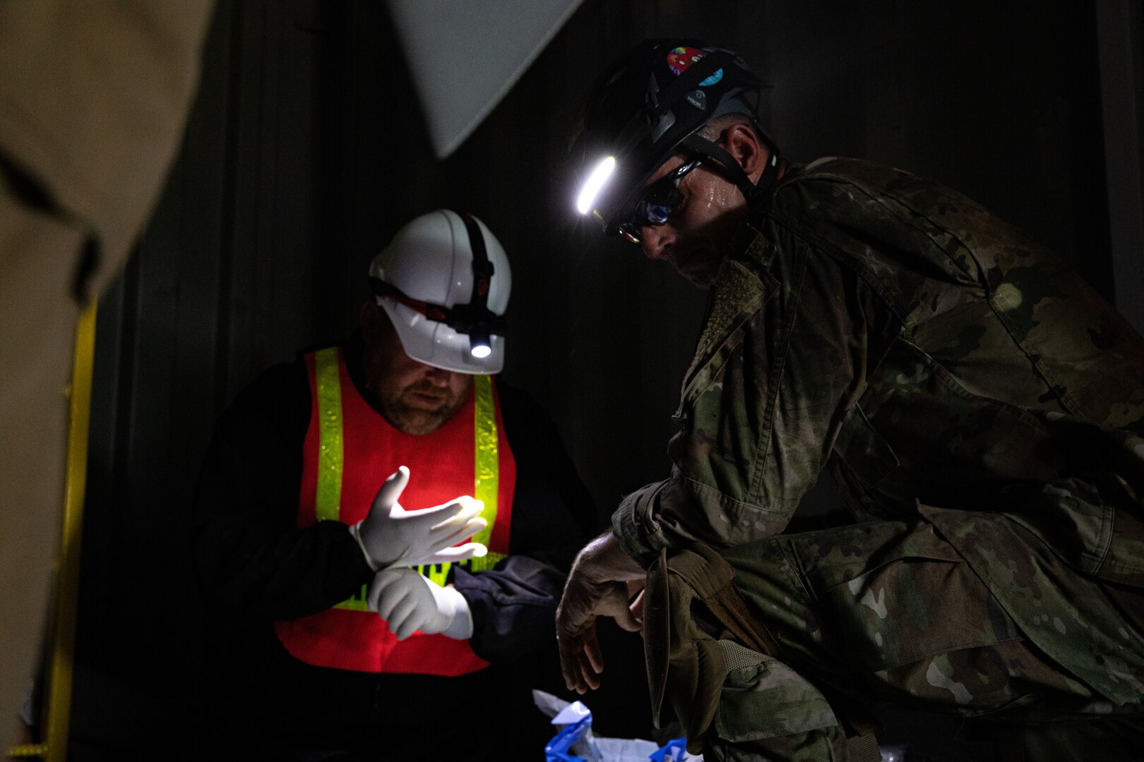 A member of the Oklahoma National Guard’s 63rd Civil Support Team, Sgt. 1st Class Ronald Poland, assesses a mock patient during a collapsed building exercise at the Edmond Fire Training Center, Edmond, Oklahoma, October 4, 2023. This simulation is part of a biennial weeklong operational readiness exercise, designed to ensure local first responder organizations maintain preparedness and familiarity with one another. (Oklahoma National Guard photo by Staff Sgt. Reece Heck)