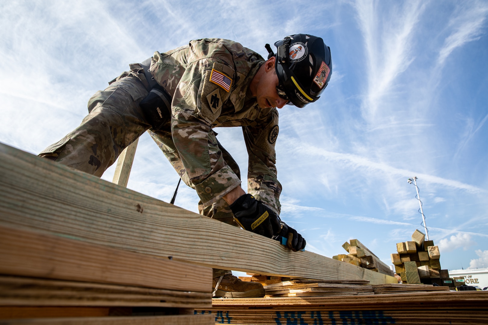 A member of the Oklahoma National Guard’s 63rd Civil Support Team, Sgt. 1st Class Ronald Poland, constructs a solid sole raker that would hold a wall in place when damaged, during a collapsed building exercise at the Edmond Fire Training Center, Edmond, Oklahoma, October 4, 2023. This simulation is part of a biennial weeklong operational readiness exercise, designed to ensure local first responders maintain preparedness and familiarity with one another. (Oklahoma National Guard photo by Staff Sgt. Reece Heck)