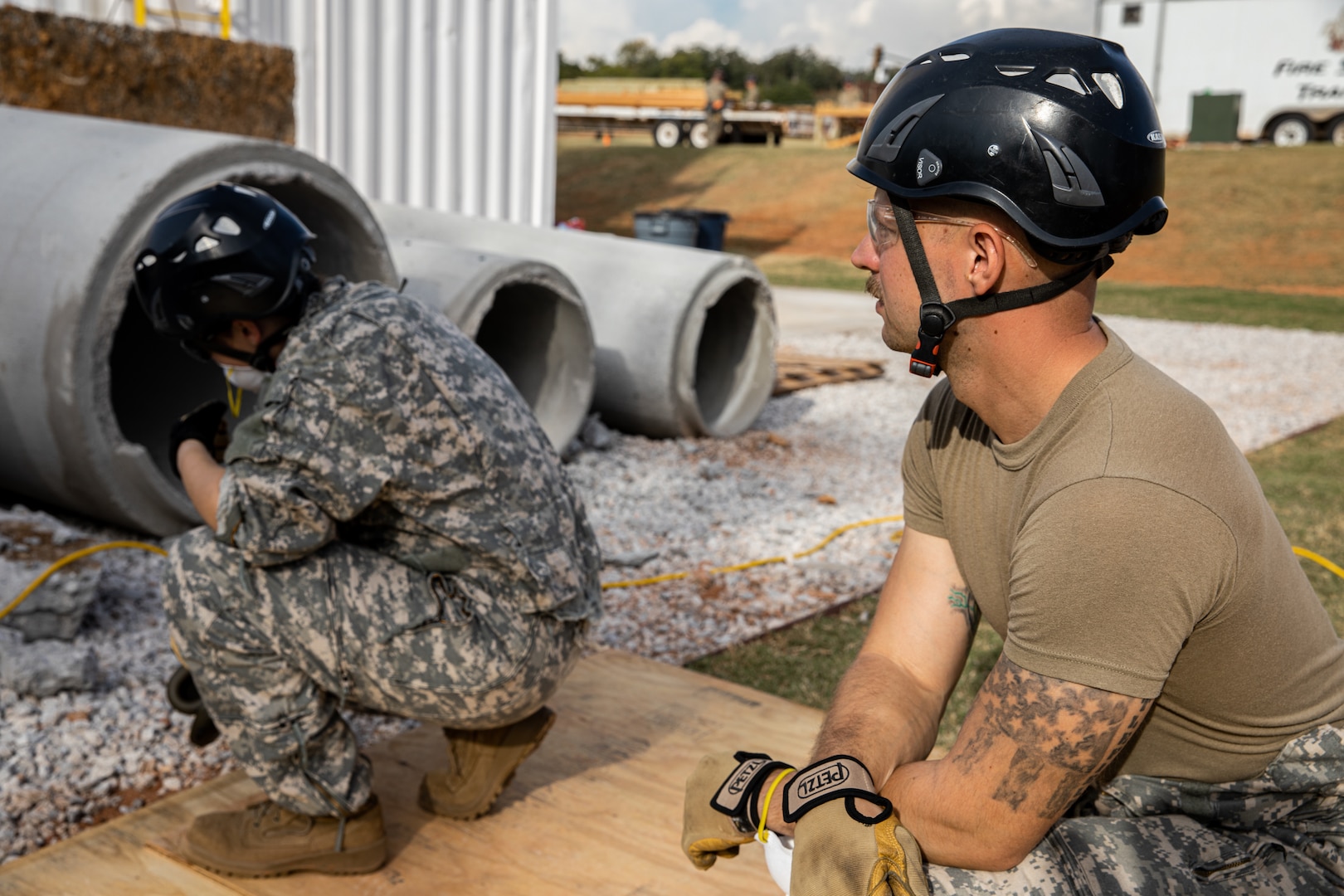 A Member of the Oklahoma National Guard’s 63rd Civil Support Team, Staff Sgt. Christina Burgess, and Warrant Officer Zachary Bradfield, help drill a hole through concrete during a collapsed building exercise at the Edmond Fire Training Center, Edmond, Oklahoma, October 4, 2023. This simulation is part of a biennial weeklong operational readiness exercise, designed to ensure local first responders maintain preparedness and familiarity with one another. (Oklahoma National Guard photo by Staff Sgt. Reece Heck)