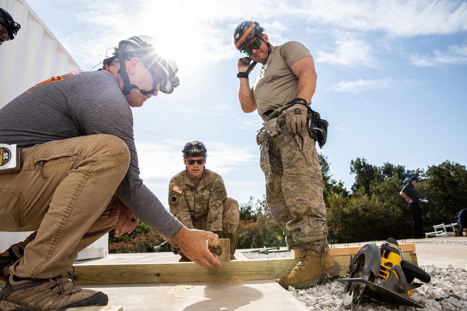 Members of the Oklahoma National Guard’s 63rd Civil Support Team, construct a solid sole raker that would hold a wall in place when damaged, during a collapsed building exercise at the Edmond Fire Training Center, Edmond, Oklahoma, October 4, 2023. This simulation is part of a biennial weeklong operational readiness exercise, designed to ensure local first responders maintain preparedness and familiarity with one another. (Oklahoma National Guard photo by Staff Sgt. Reece Heck)