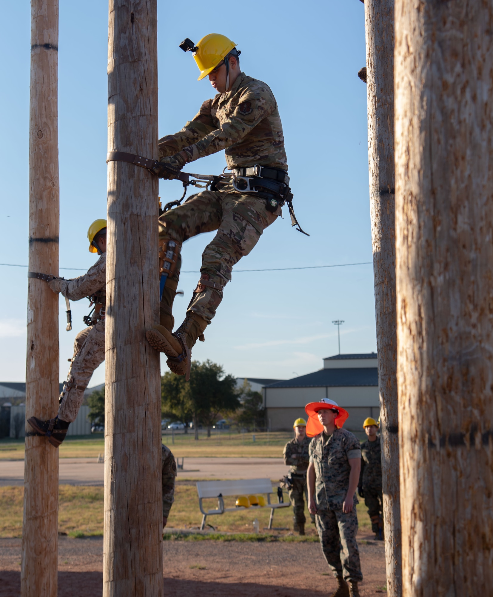 Lineman climb utility poles