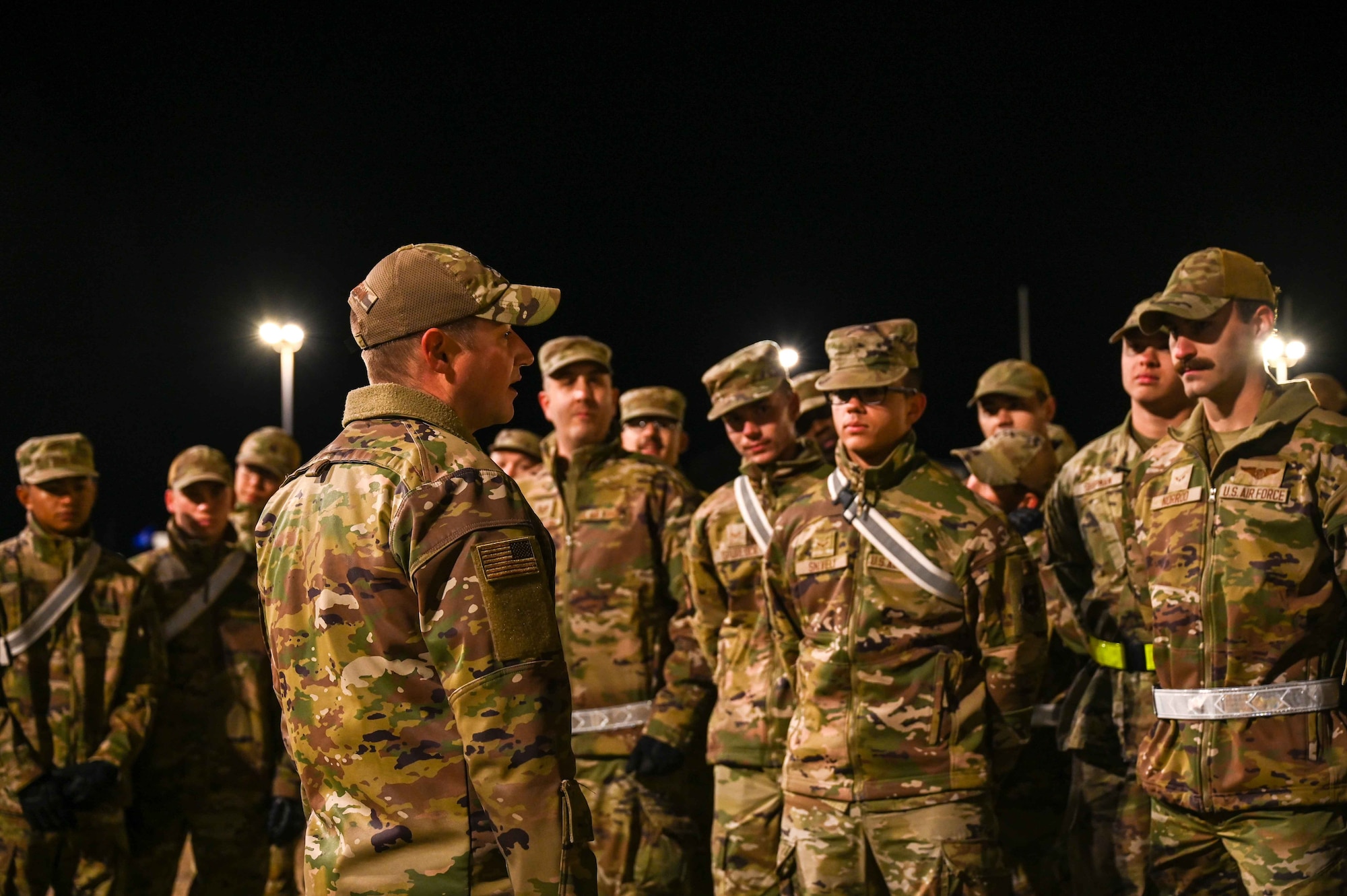 U.S. Air Force Lt. Col. Ben Davidson, 97th Training Squadron (TRS) commander, gives a speech to TRS students before they begin the first portion of the Talon Challenge at Altus Air Force Base, Oklahoma, Oct. 14, 2023. Their day began with a march from the running track to the training area, one and a half miles away. (U.S. Air Force photo by Airman 1st Class Kari Degraffenreed)