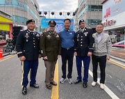 Leadership from the U.S. Army Medical Materiel Center-Korea pose for a photo with Chilgok County Gov. Kim Jae-wook, center, during opening ceremonies of the 10th annual Nakdong River World Peace and Culture Festival in Waegwan, Republic of Korea. Pictured, from left, are USAMMC-K Deputy Commander Maj. Myong “Mike” Pak, USAMMC-K Commander Lt. Col. Mark Sander, Kim, Sgt. 1st Class Evan Spayd, USAMMC-K senior enlisted adviser, and No Chae-il, a member of management staff for the U.S. Army Medical Materiel Agency’s Army Prepositioned Stocks site in Korea. (Photo Credit: Courtesy)