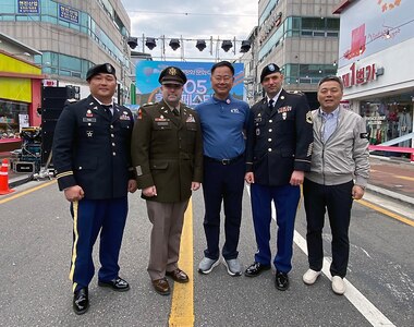 Leadership from the U.S. Army Medical Materiel Center-Korea pose for a photo with Chilgok County Gov. Kim Jae-wook, center, during opening ceremonies of the 10th annual Nakdong River World Peace and Culture Festival in Waegwan, Republic of Korea. Pictured, from left, are USAMMC-K Deputy Commander Maj. Myong “Mike” Pak, USAMMC-K Commander Lt. Col. Mark Sander, Kim, Sgt. 1st Class Evan Spayd, USAMMC-K senior enlisted adviser, and No Chae-il, a member of management staff for the U.S. Army Medical Materiel Agency’s Army Prepositioned Stocks site in Korea. (Photo Credit: Courtesy)