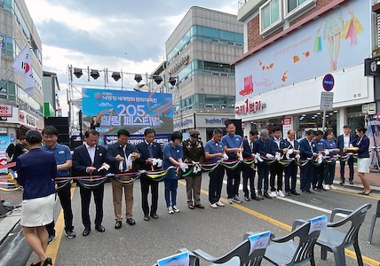 Officials prepare to cut a ribbon to kick off the 10th annual Nakdong River World Peace and Culture Festival in Waegwan, Republic of Korea. (Photo Credit: Courtesy)