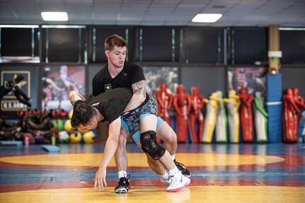 Spc. Dalton Duffield, an Oklahoma Army National Guard Soldier and Moore, Oklahoma native, throws his competitor during a wrestling practice match at Fort Carson, Colorado, Aug. 8, 2023. Duffield is a member of the Oklahoma National Guard and a Greco-Roman wrestler pursuing his Olympic goals through the U.S. Army's World Class Athlete Program. (Oklahoma National Guard photo by Anthony Jones)