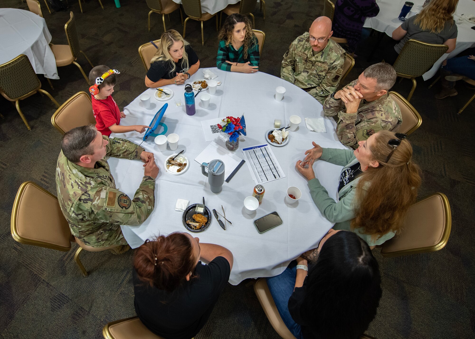 A group of Airman and spouses at a table