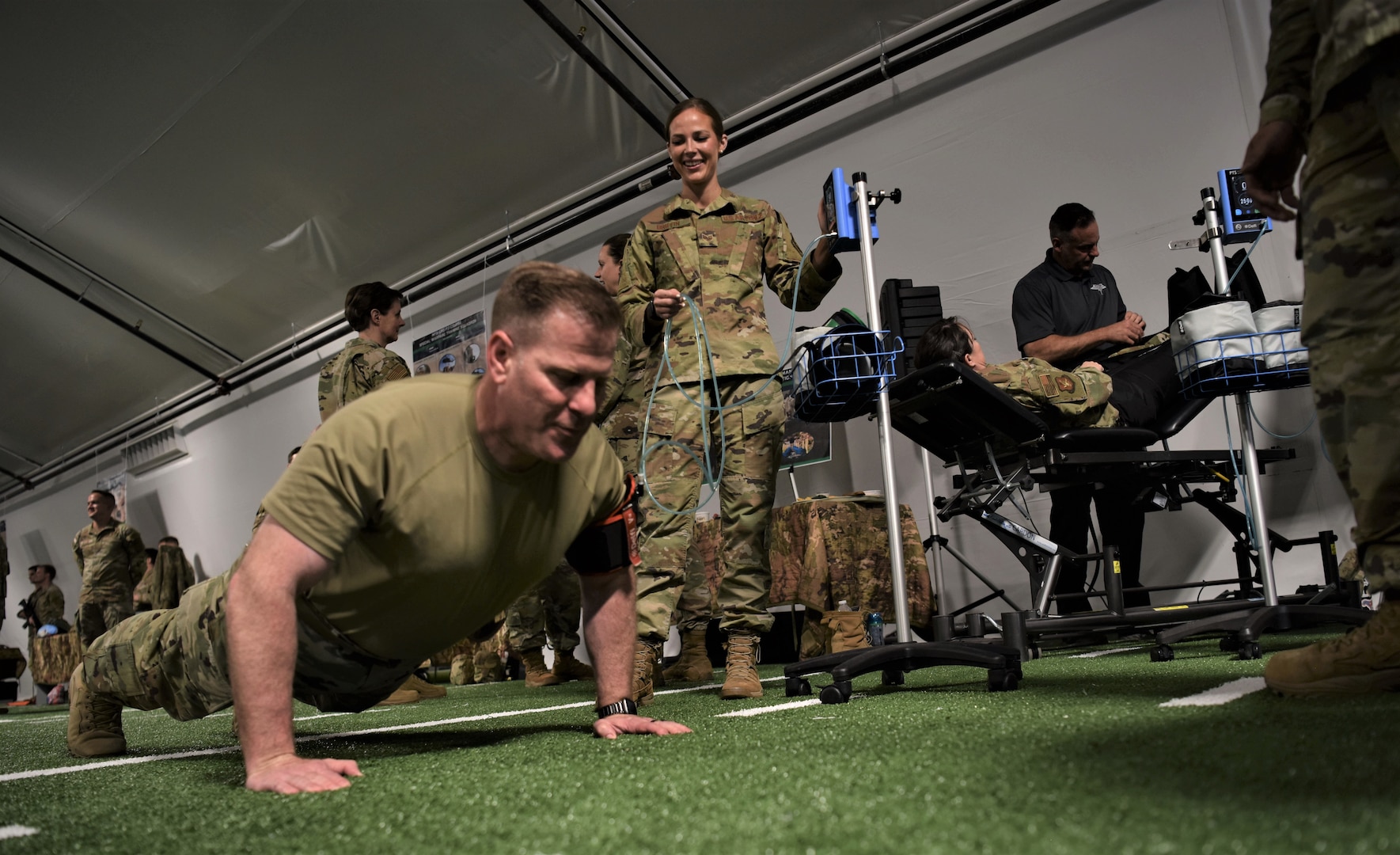 Push-ups on turf in the Temporary Human Performance Center