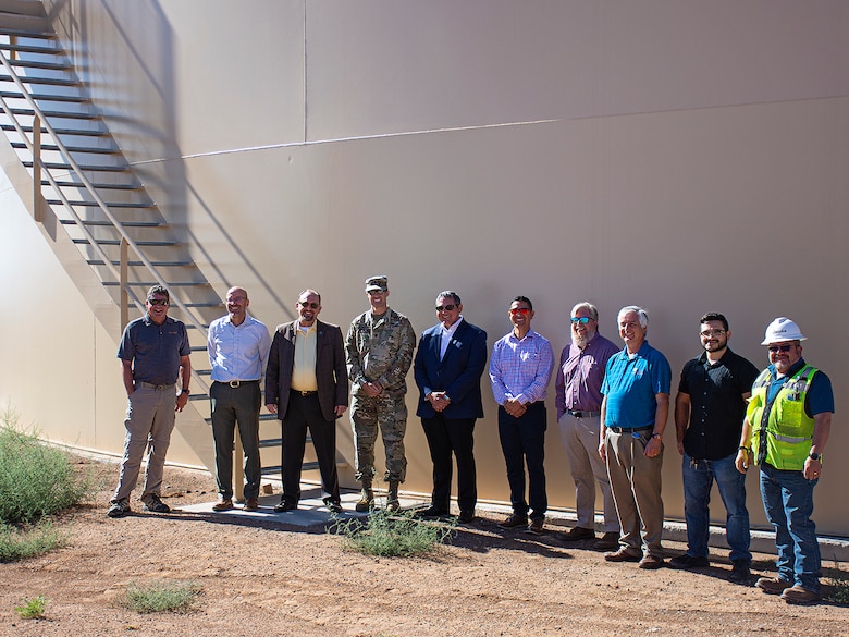 Rio Rancho Mayor Gregg Hull, 3rd from left, and Albuquerque District Commander Lt. Col. Jerre Hansbrough, 4th from left, join other USACE and Rio Rancho representatives for a photo in front of Rio Rancho’s Water Tank #9, Aug. 9, 2023.